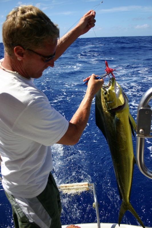 Perfecting our fishing techniques on the way to Rarotonga.